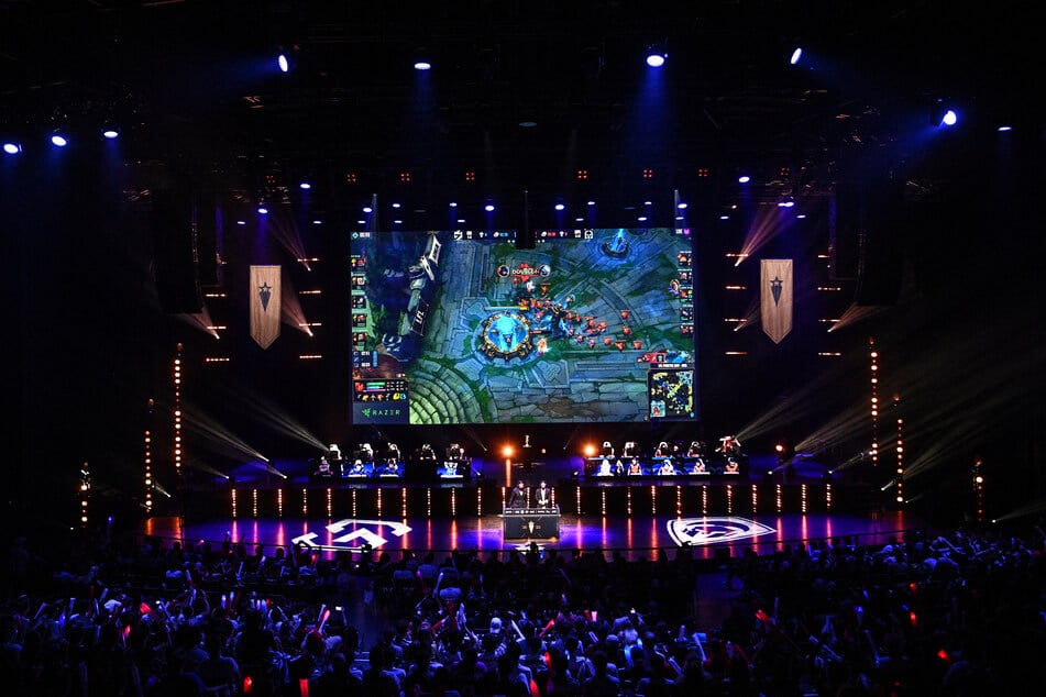 Professional E-sport players compete on stage in an LFL Prixtel Day League of Legends e-sport competition at La Seine Musicale in Paris on July 21, 2022.