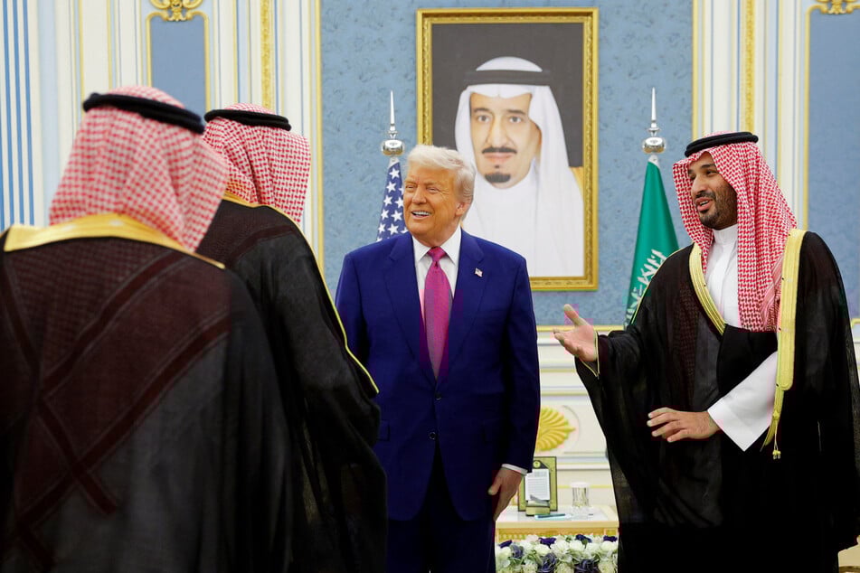 President Donald Trump (c.) is welcomed by Saudi Crown Prince Mohammed Bin Salman (r.) in Riyadh, Saudi Arabia, on May 13, 2025.