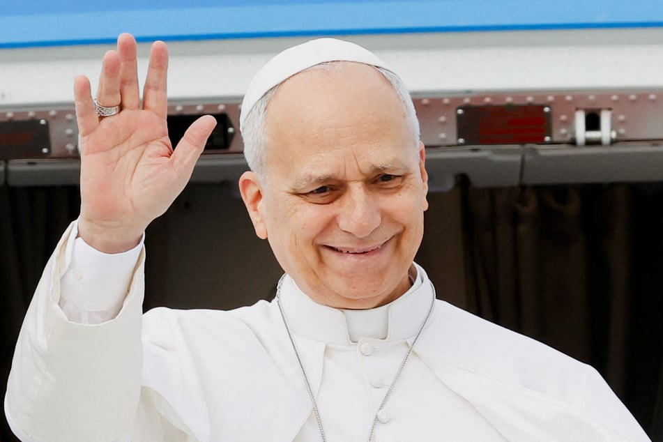 Pope Leo XIV waves as he boards the papal plane ahead of his first apostolic journey to Algeria, Angola, Cameroon, and Equatorial Guinea, at Fiumicino Airport, near Rome, Italy, on April 13, 2026.