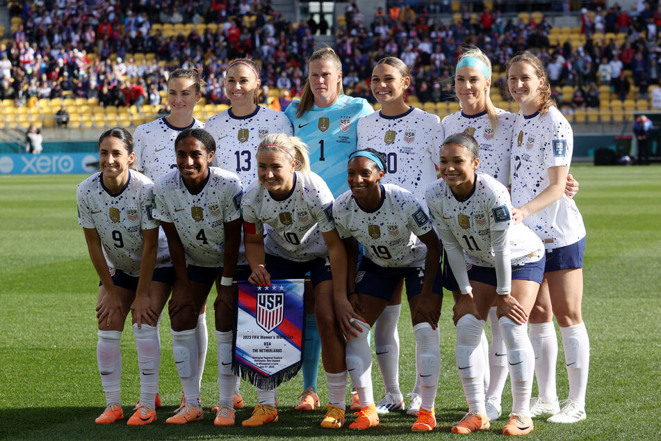 USWNT players pose for a team group photo before their match against the Netherlands.