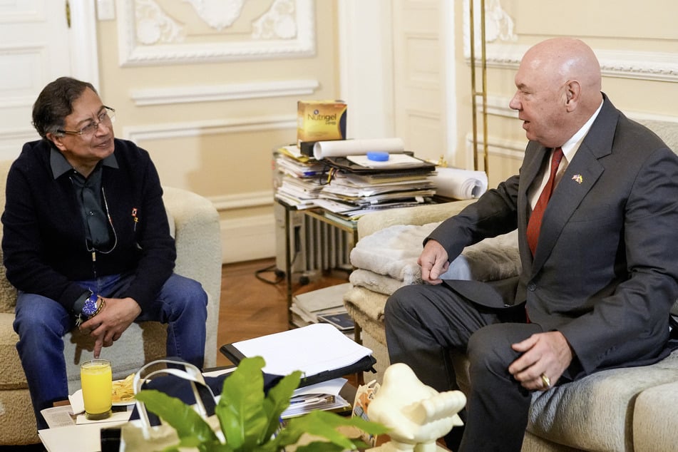 Colombia's President Gustavo Petro (l.) speaks with US Embassy Charge d'Affaires John McNamara during a meeting at Narino presidential palace in Bogotá on October 20, 2025.