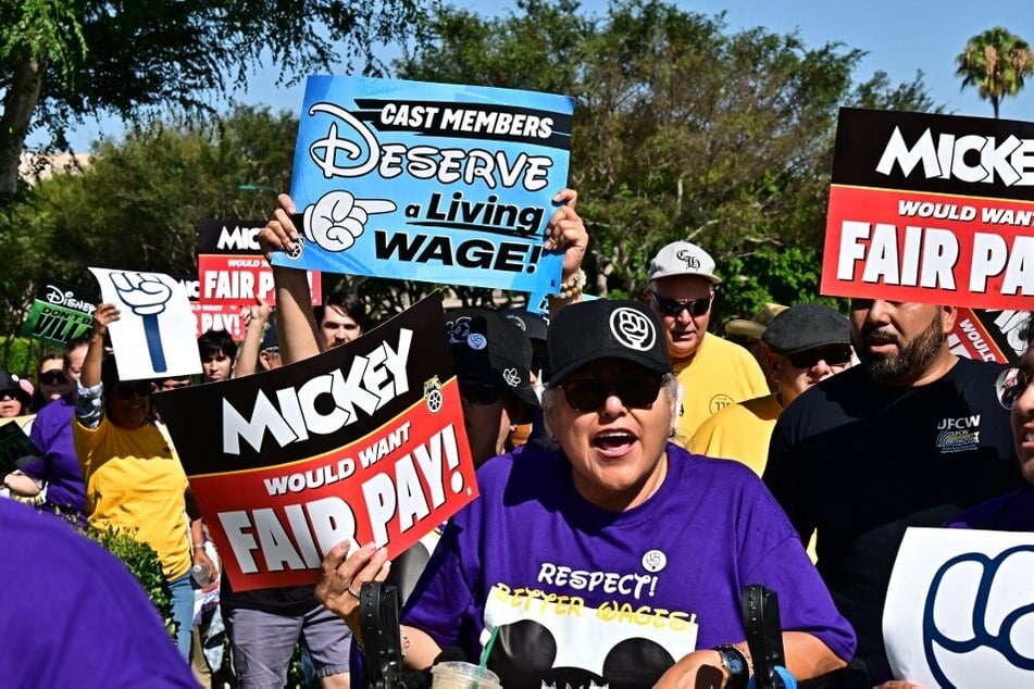 More than 200 Disneyland Resort employees protest for better wages and working conditions ahead of a looming strike vote.