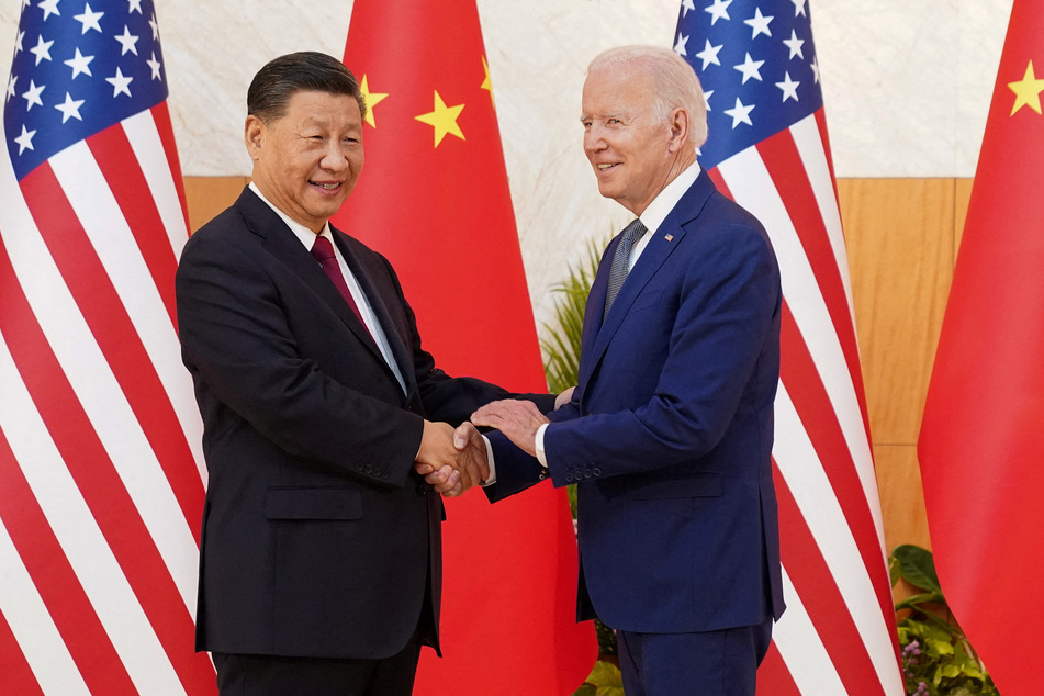 Chinese leader Xi Jinping and US President Joe Biden shake hands ahead of their meeting in Bali, Indonesia.