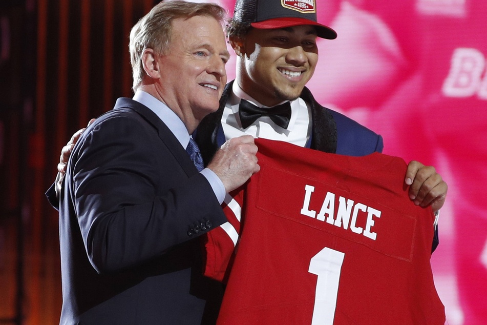 Commissioner Roger Goodell poses for a photo with QB Trey Lance at the 2021 NFL Draft