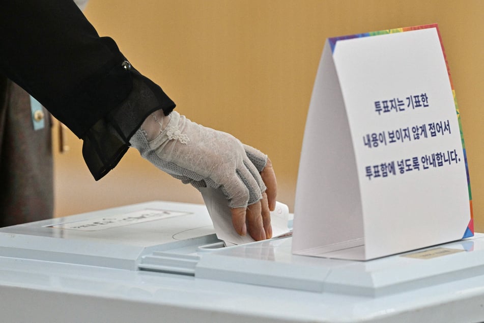 A woman casts her ballot at a polling station during the presidential election in Seoul, South Korea, on June 3, 2025.