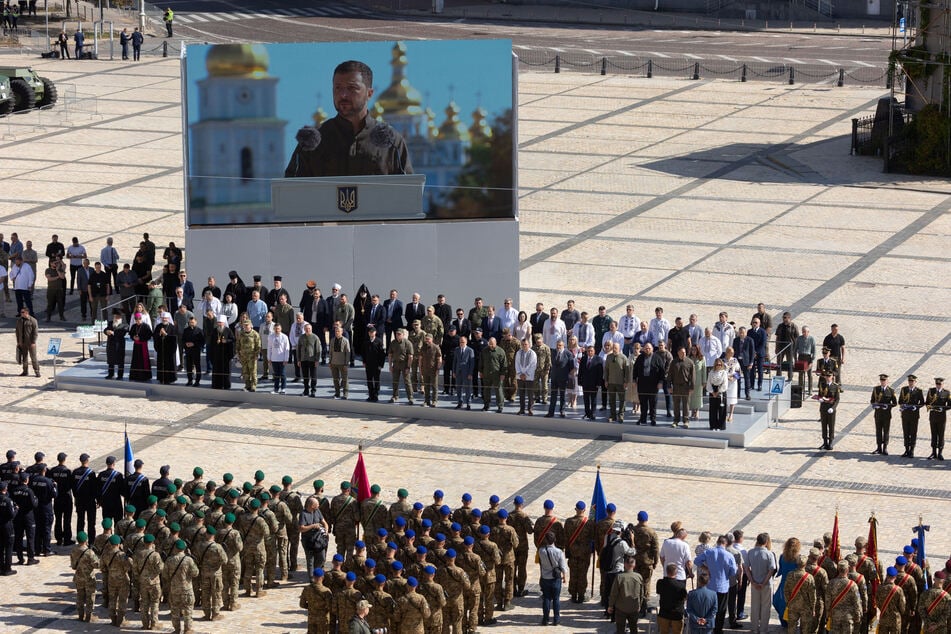 Ukraine's President Volodymyr Zelensky appears on a screen as he delivers a speech during the country's Independence Day celebrations in Kyiv.