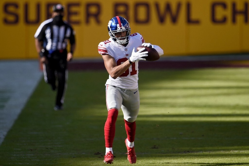 Wide receiver Austin Mack, in his NFL rookie season for the New York Giants, making a catch against the Washington Commanders.