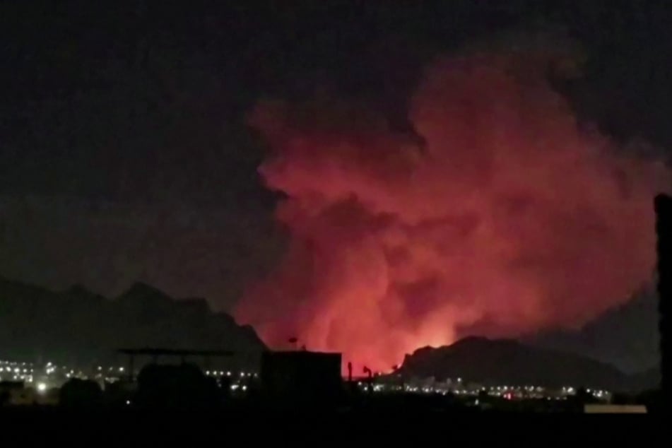 This video grab taken from undated UGC images posted on social media on March 31, 2026, shows smoke billowing as explosions rock Iran's Isfahan.