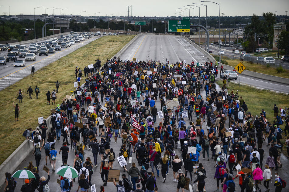 People shut down I-225 to protest the death of Elijah McClain on July 25, 2020 in Aurora, Colorado. A car drove through the protest further along during the march and a protestor was also shot.