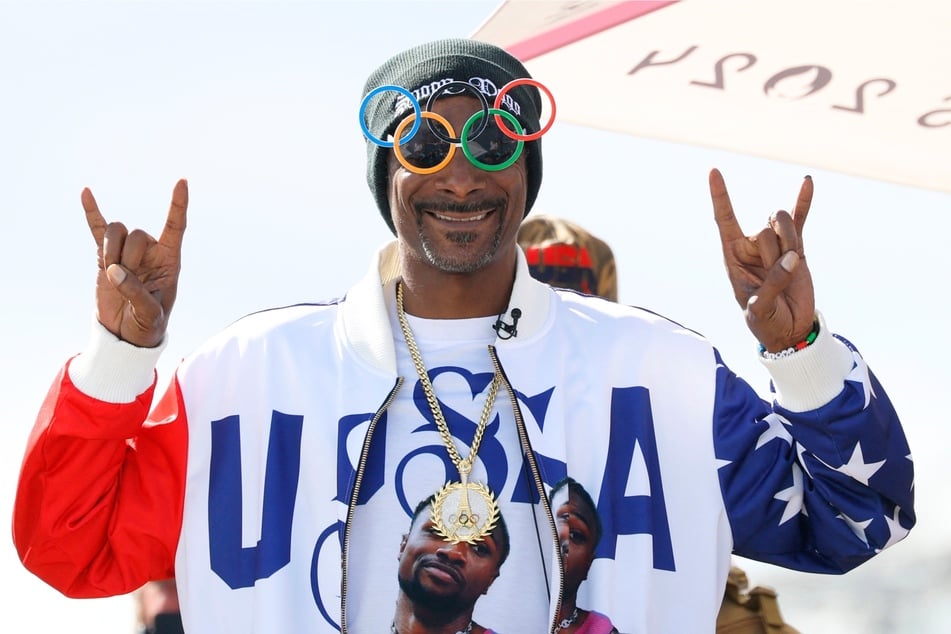 Snoop Dogg poses ahead of the men's park skateboarding final during the Paris 2024 Olympic Games at La Concorde in Paris on August 7, 2024.