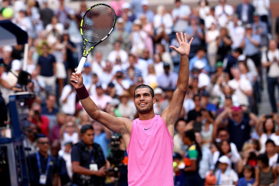 Spain's Carlos Alcaraz celebrates winning his fourth round match against France's Arthur Rinderknech at the 2025 US Open.