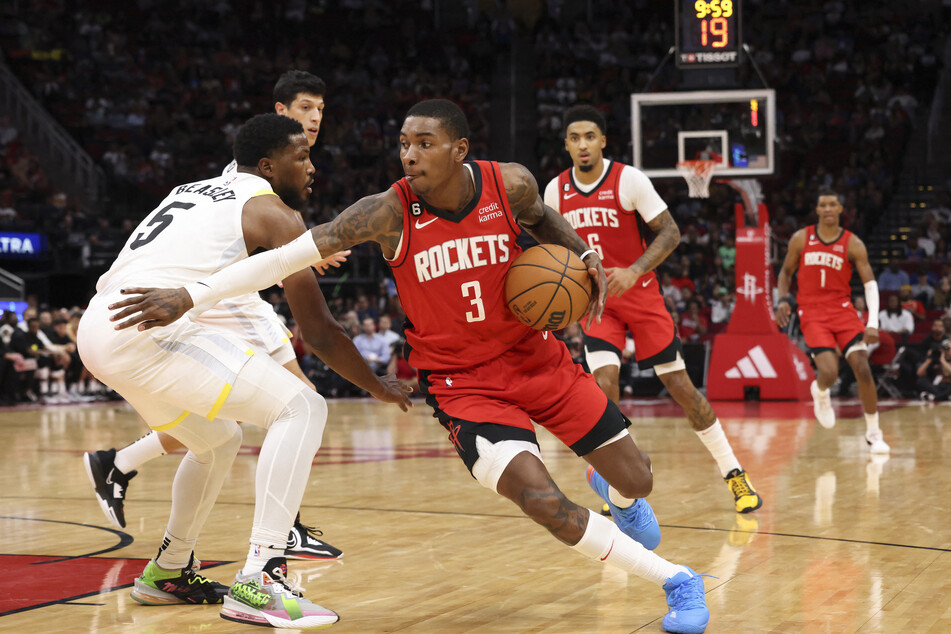 Houston Rockets guard Kevin Porter Jr. dribbles against Utah Jazz guard Malik Beasley in the second half at the Toyota Center.