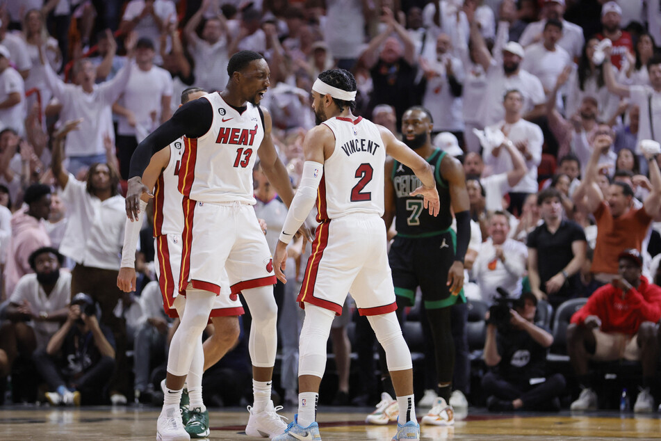 Bam Adebayo (l.) and Gabe Vincent of the Miami Heat celebrate during their win over the Boston Celtics.