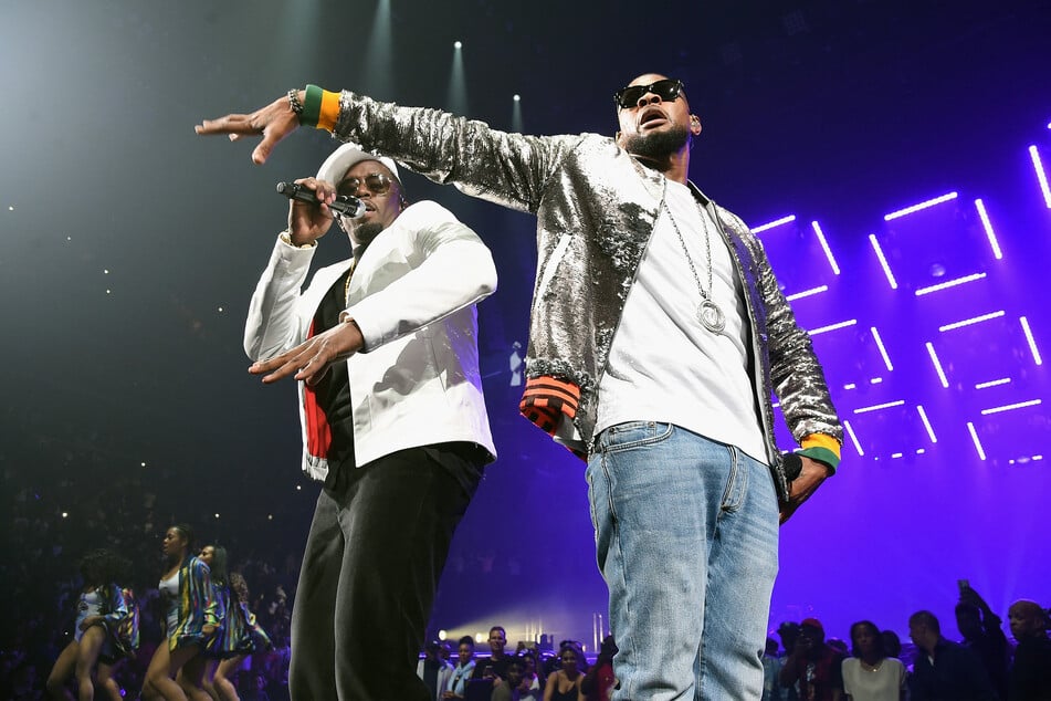 Usher defended his mentor, Sean "Diddy" Combs (r.), and said that fans have forgotten the impact that his career has had on music.