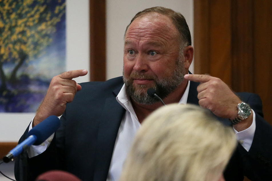 Alex Jones has been accused of funneling millions of dollars to himself and his relatives by families of nine Sandy Hook shooting victims.