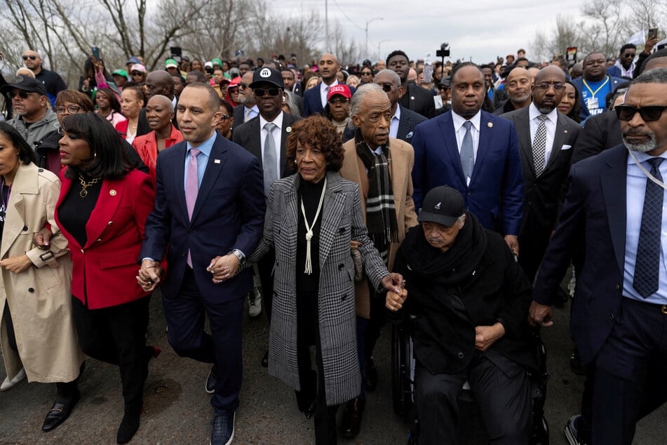 Congresswoman Terri Sewell, House Minority Leader Hakeem Jeffries, Congresswoman Maxine Waters, and civil rights leaders Al Sharpton and Jesse Jackson march across the Edmund Pettus Bridge in Selma, Alabama.