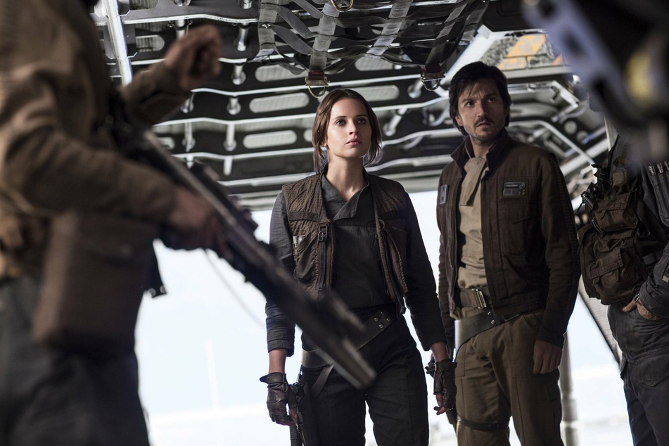 Felicity Jones and Diego Luna (r) star as Jyn Erso and Cassian Andor in the 2016 film, Rogue One.