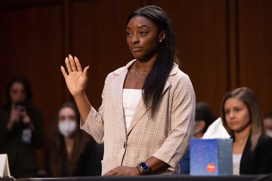 Simone Biles is sworn in to testify during a Senate Judiciary Committee hearing on the FBI's mishandling of sex abuse allegations.