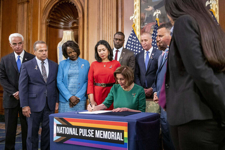 House Speaker Nancy Pelosi signs a bill calling for the creation of a National Pulse Memorial.