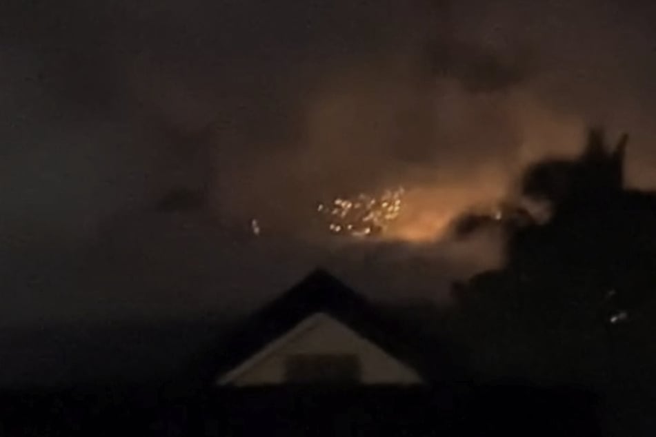 The eruption of Mount Kanlaon in La Castellana, Negros Occidental, Philippines, on May 13, 2025, is captured in a screen grab obtained from social media.
