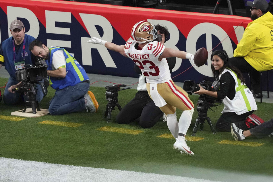 San Francisco 49ers running back Christian McCaffrey scores a touchdown during the first half of Super Bowl LVIII at Allegiant Stadium.