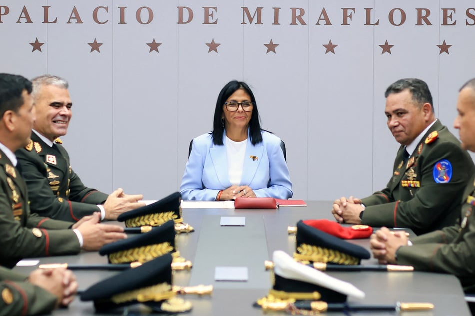 Delcy Rodriguez (c.) has replaced several top officials in Venezuela with those who are seen as acceptable to the US.