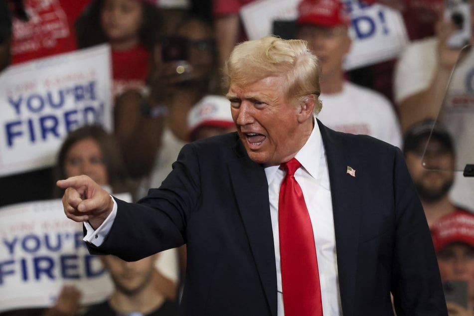 Former US President and 2024 Republican presidential candidate Donald Trump arrives to speak during a campaign rally at the Georgia State University Convocation Center in Atlanta, Georgia, on Saturday.