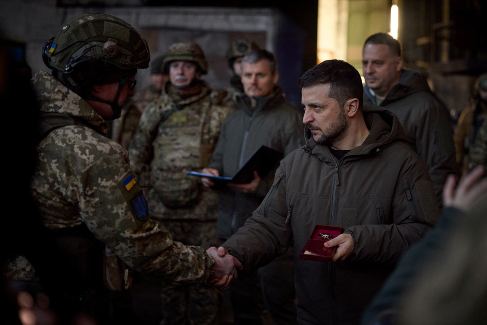 Ukraine President Volodymyr Zelensky shaking hands with a soldier during his visit to the eastern city of Bakhmut.