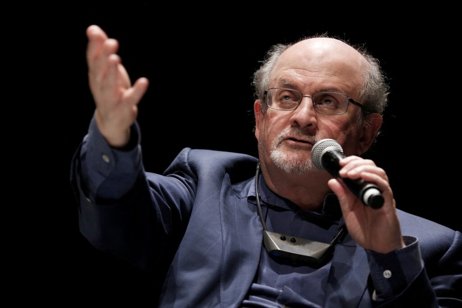 Salman Rushdie, whose controversial writings made him the target of a fatwa that forced him into hiding, was stabbed in the neck by an attacker on stage Friday in western New York state.