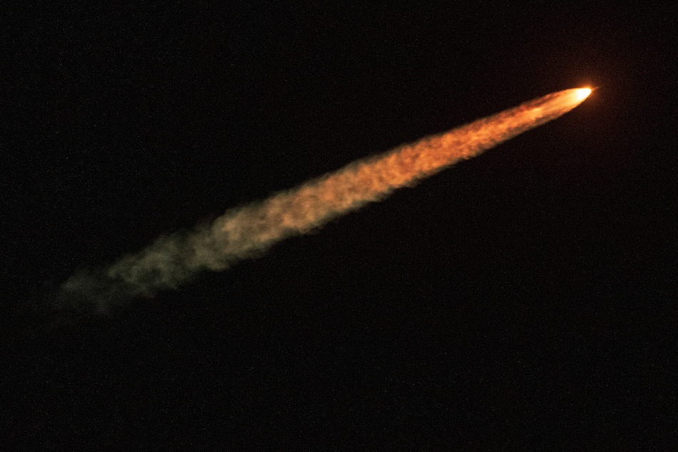 NASA's next-generation moon rocket, the Space Launch System rocket with the Orion crew capsule, lifts off from launch complex 39-B on the unmanned Artemis 1 mission to the moon.