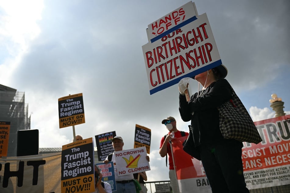 People protest outside the US Supreme Court over President Donald Trump's move to end birthright citizenship on May 15, 2025.