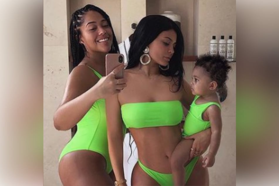 A photo of Jordyn Woods (l) with former BFF Kylie Jenner (c), and Jenner's daughter.