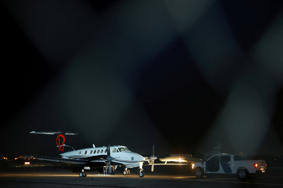 A plane believed to have carried Mexican drug lord Ismael "El Mayo" Zambada and Joaquin Guzman Lopez, the son of Zambada's former partner, Joaquin "El Chapo" Guzman, who were arrested in El Paso, Texas, is seen on the tarmac of the Dona Ana County private airport in Santa Teresa, New Mexico.