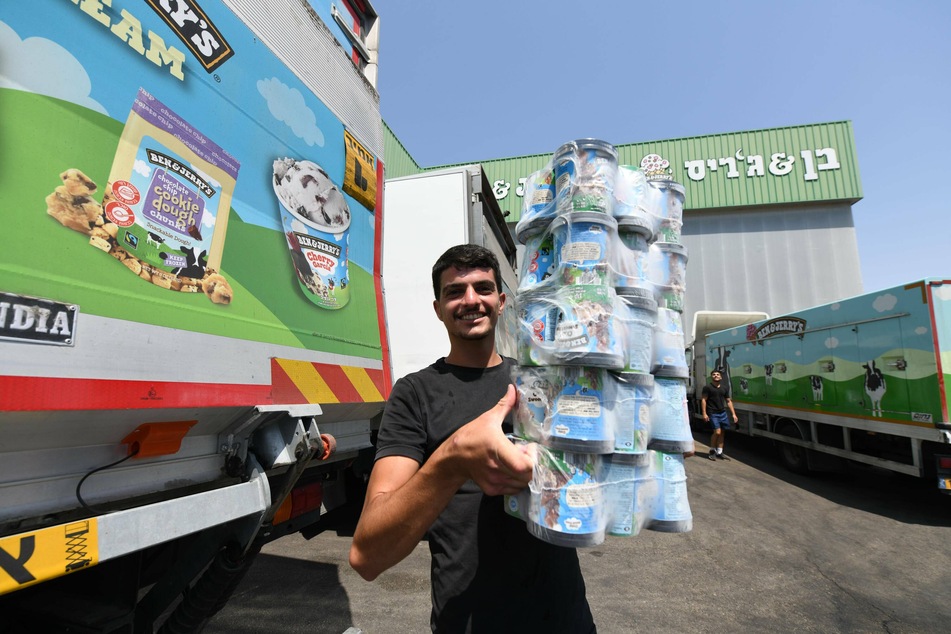 A worker handles tubs of Ben &amp; Jerry's ice cream at a factory in Beer Tuvia, southern Israel.
