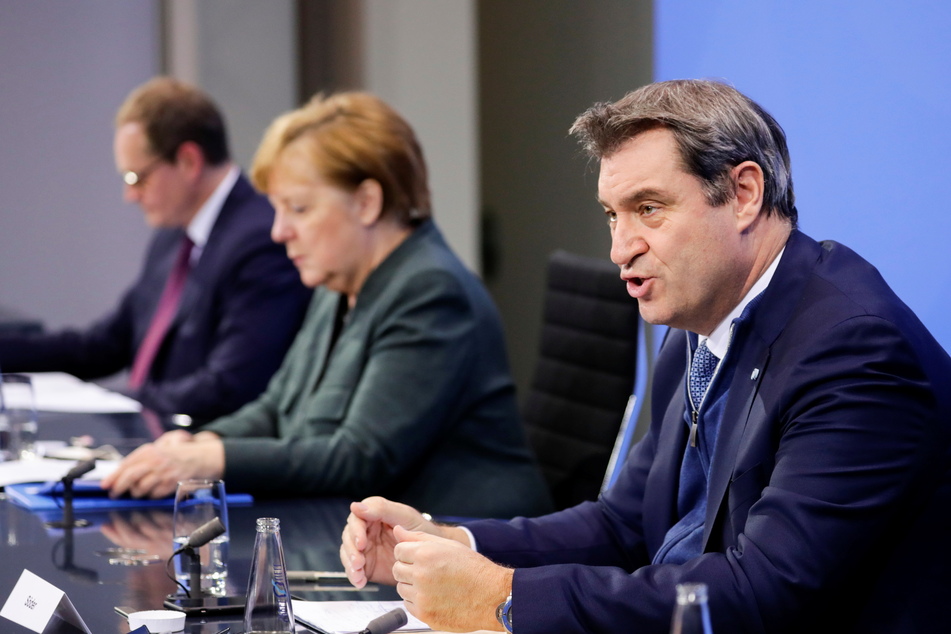 Markus Söder (CSU, r.) hat die erneute Verlängerung des Lockdowns samt Schulschließungen verteidigt.