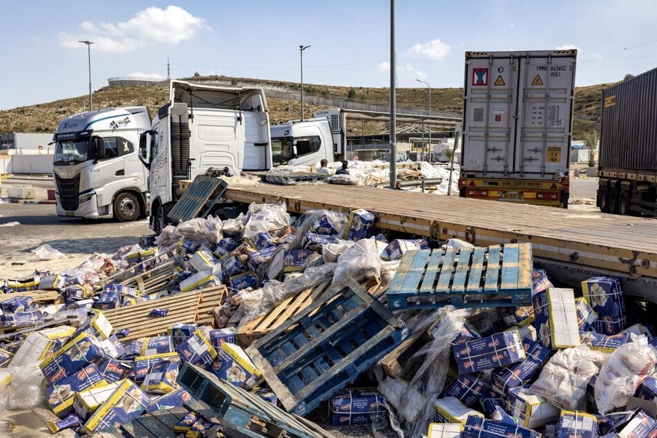 Damaged trailer trucks that were carrying humanitarian aid supplies for Gaza are pictured on the Israeli side of the Tarqumiyah crossing with the occupied West Bank after they were attacked by Israeli settlers.