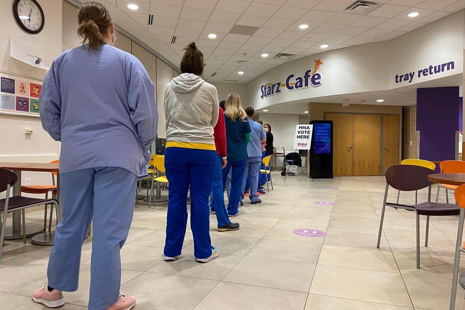 Nurses in St. Paul, Minnesota, line up to vote on whether to authorize an unfair labor practices strike.