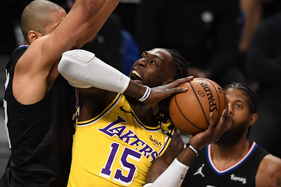 Montrezl Harrell of the Los Angeles Lakers drives to the basket against Nicolas Batum of the LA Clippers.