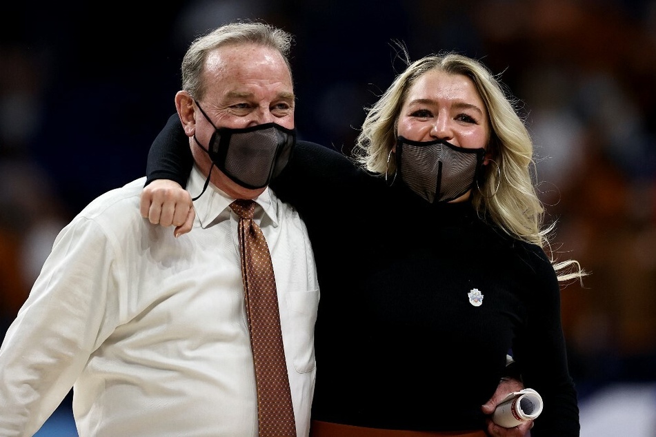 Vic Schaefer (l.) and daughter of the Texas Longhorns celebrate the win over the Maryland Terrapins during the NCAA Sweet Sixteen Tournament.
