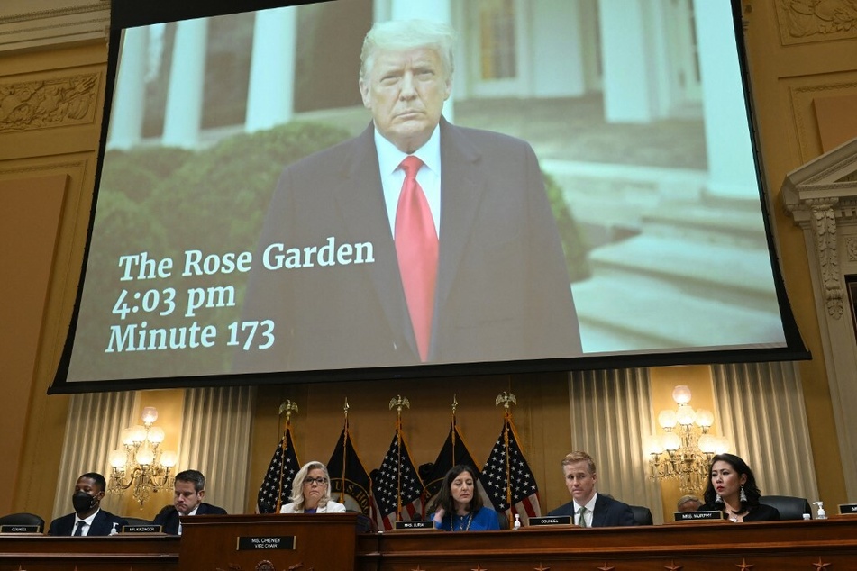 A January 6 video of ex-president Donald Trump telling his supporters to go home is seen on screen during Thursday's hearing.