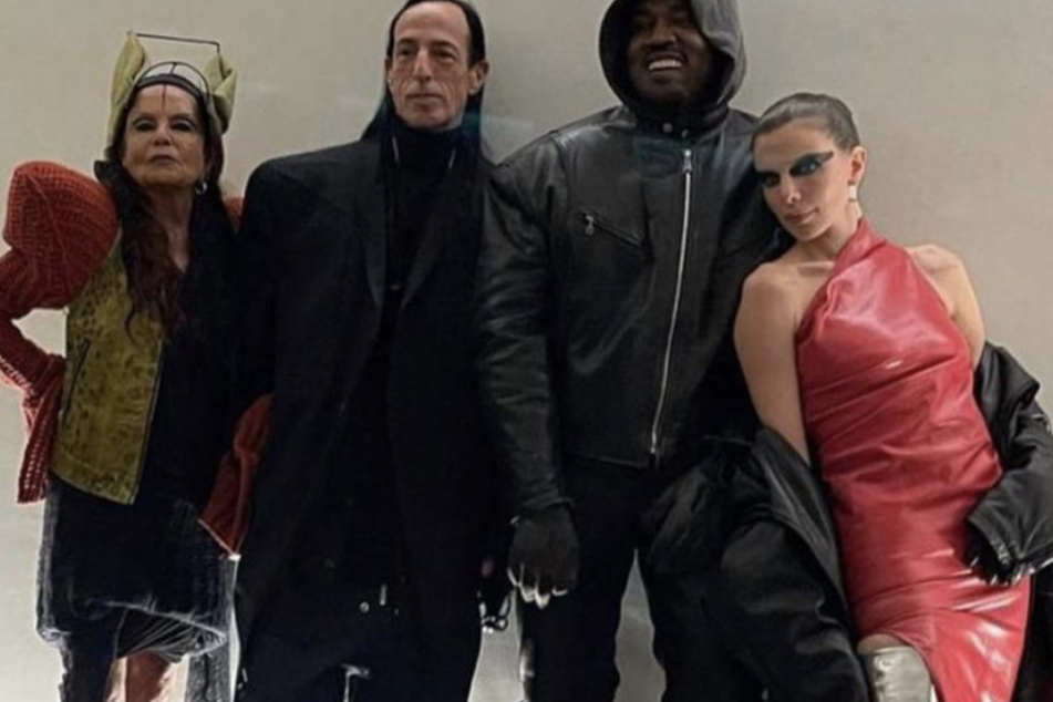 Ye (r) and Juliar (r) posed with designers while attending Paris Men Fashion Week.