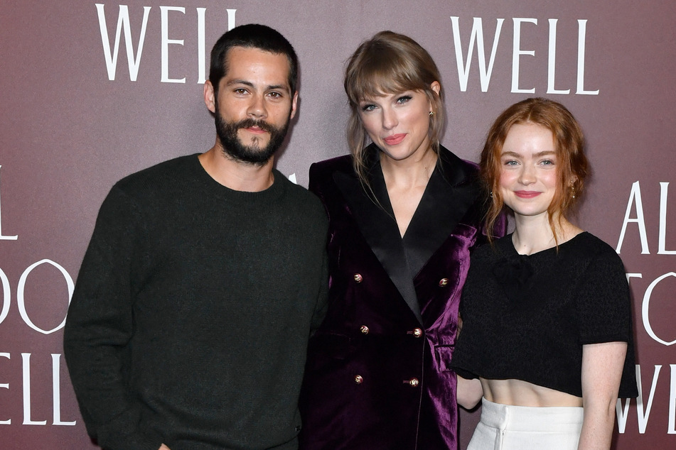 Sadie Sink (r) and Dylan O'Brien (l) star in All Too Well: The Short Film, directed by Taylor Swift (c).