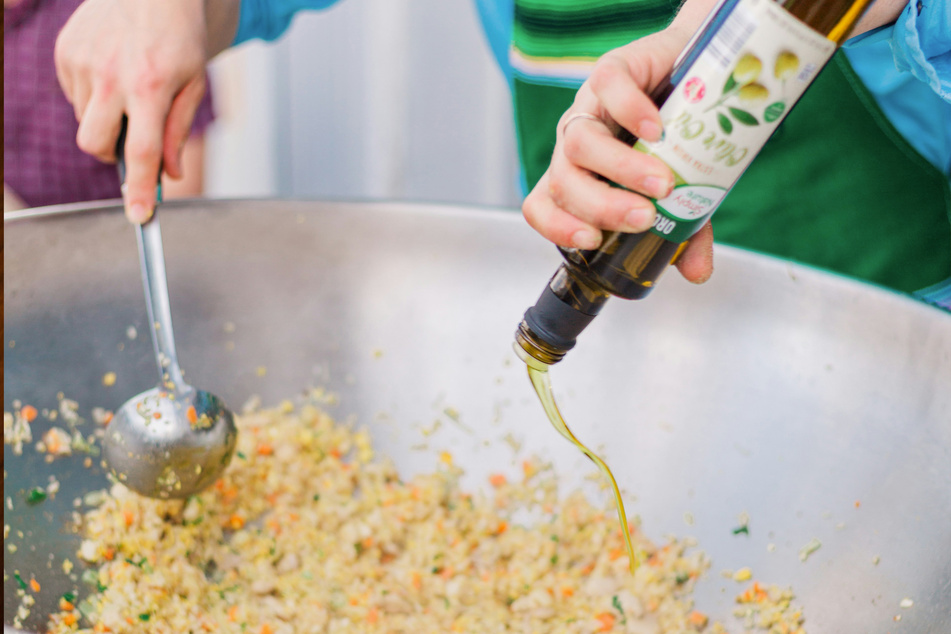 It would be ideal to use a wok when making egg fried rice - but don't use olive oil, for goodness' sake!