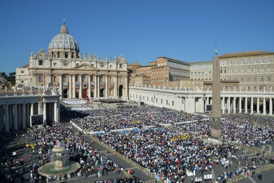 A crowd of worshippers gathers outside St. Peter's Basilica for a mass led by Pope Francis.