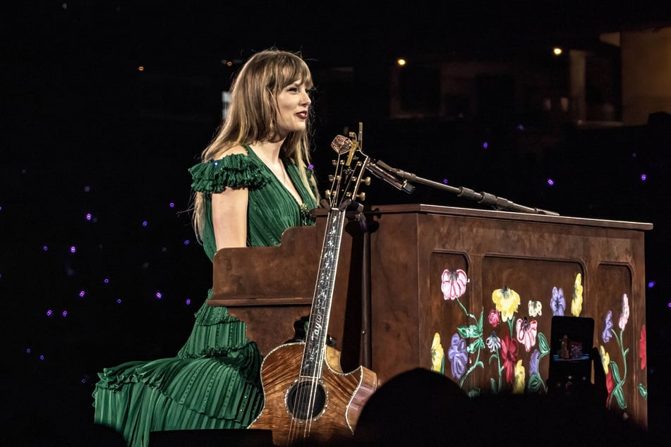 Taylor Swift plays two surprise songs at each Eras Tour show - one on the guitar and one on the piano.