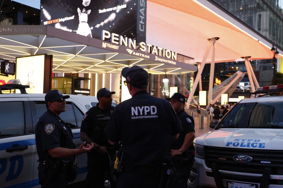 NYPD police officers are seen outside Penn Station in New York on June 7, 2026.