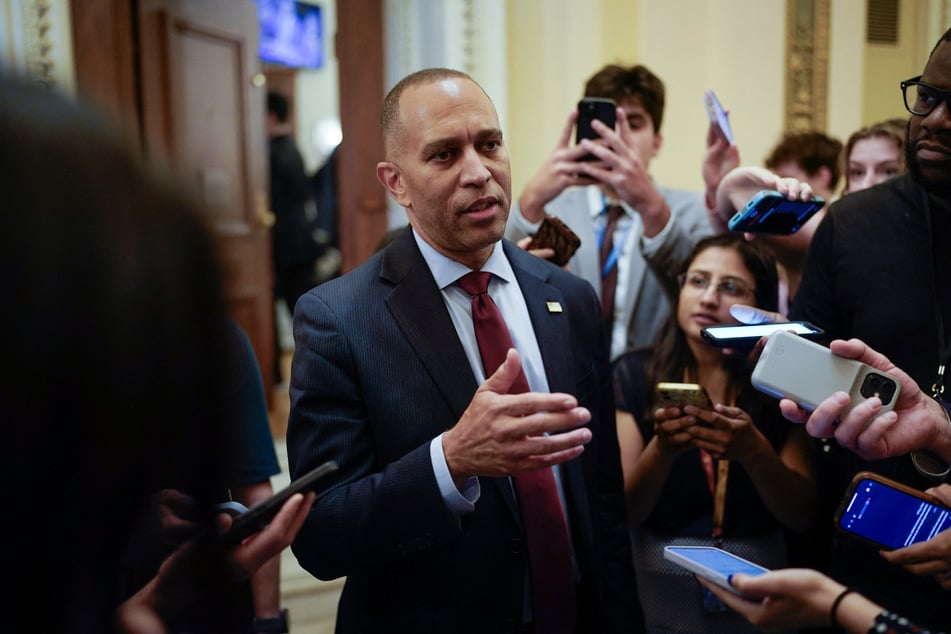US House Minority Leader Hakeem Jeffries, Democrat of New York talks to reporters as he leaves the House floor after speaking for 8 hours and 45 minutes as the House debates the One, Big, Beautiful Bill Act at the US Capitol on Thursday in Washington, DC.