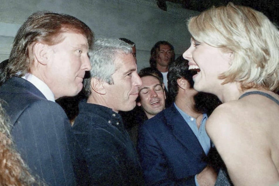 This undated photo from the personal collection of Jeffrey Epstein, provided by the Democrats on the House Oversight Committee on Friday, shows US President Donald Trump (L), flanked by Epstein (C), talking to an unknown woman.