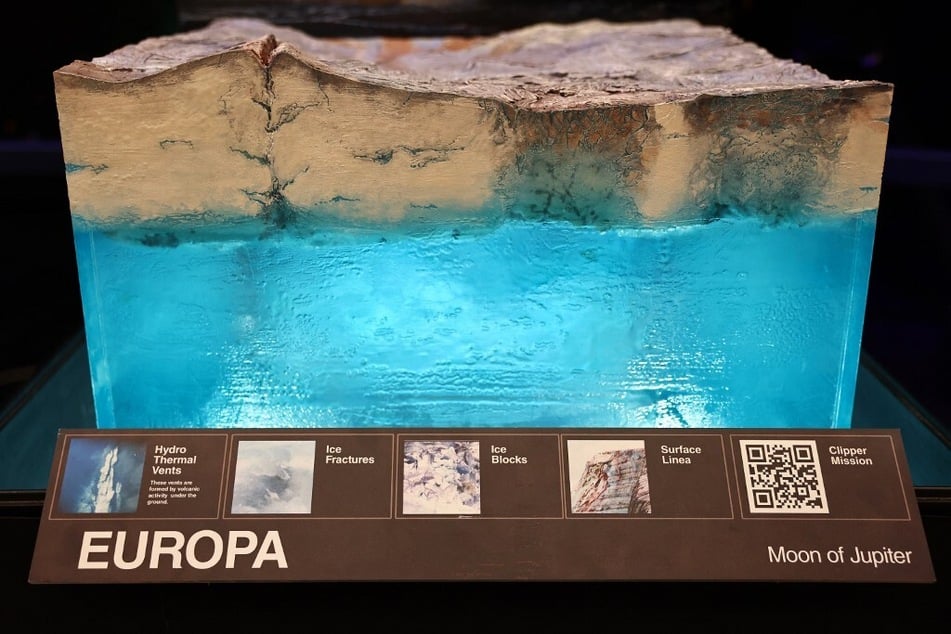 A model depicts a speculated view of Europa's ocean during a media tour at NASA's Jet Propulsion Laboratory.