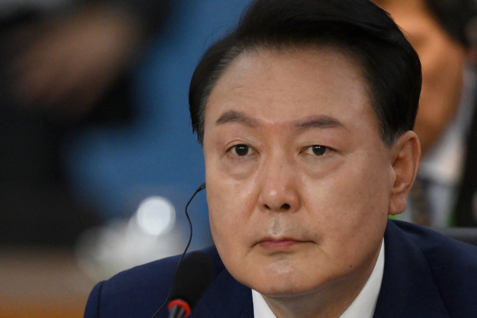 South Korean ex-president gets jail sentence in first martial law verdict